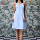 Stylera slim fit casual dress with lace up front in light blue worn by model