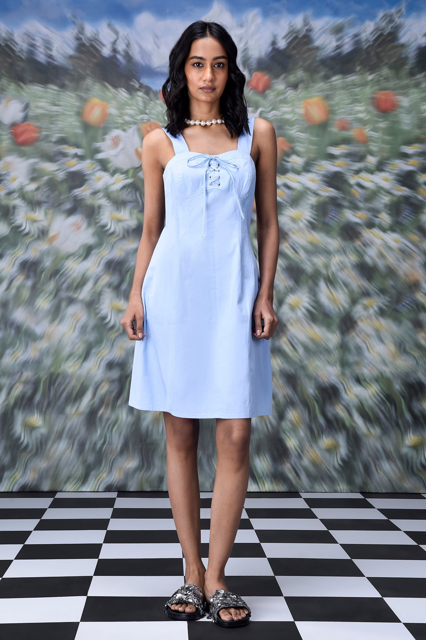 Stylera slim fit casual dress with lace up front in light blue worn by model