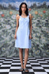 Stylera slim fit casual dress with lace up front in light blue worn by model