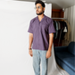 Stylera model wearing statement striped shirt purple short sleeve camp collar with light wash jeans
