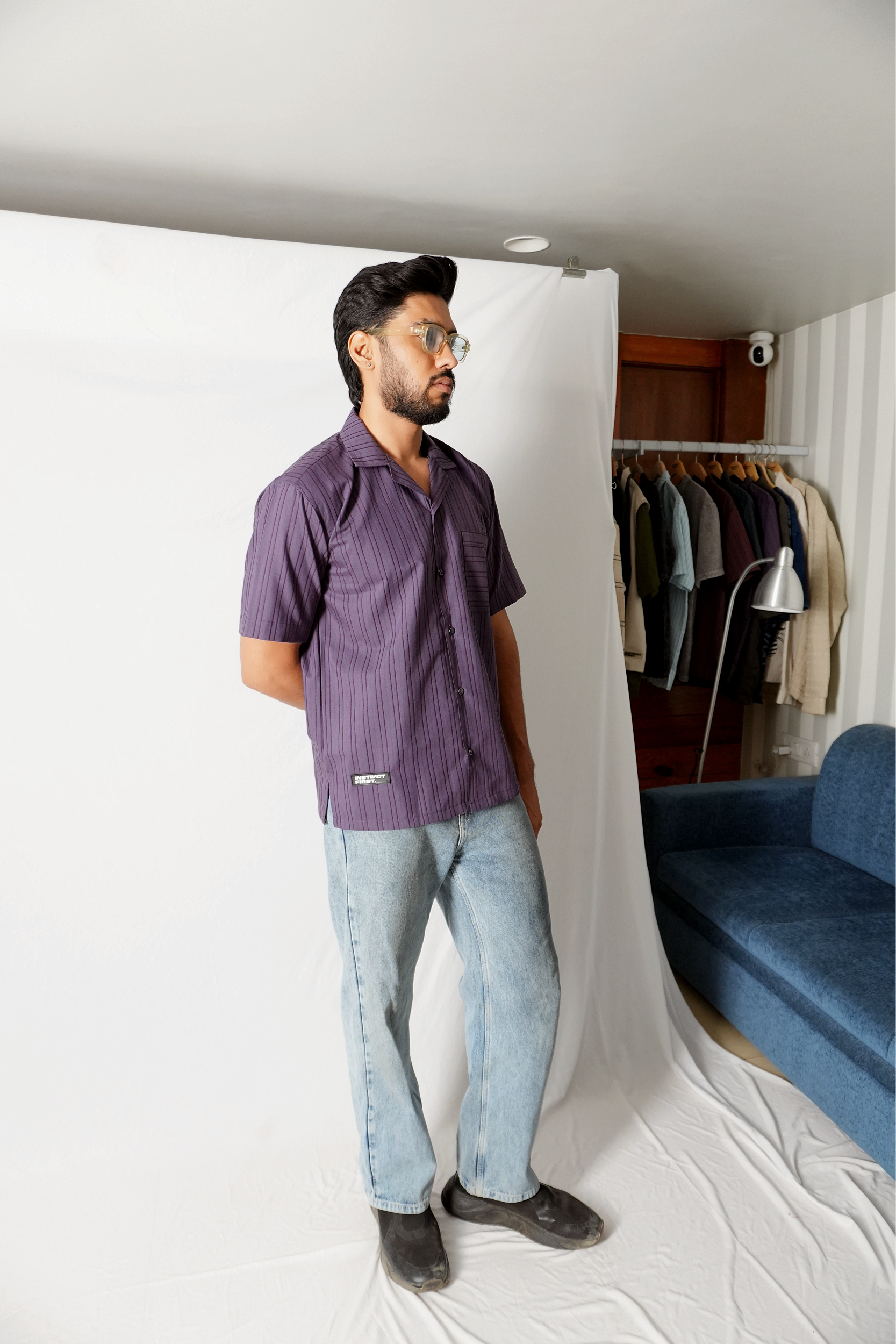 Stylera model wearing a statement striped shirt purple short sleeve button shirt with casual fit