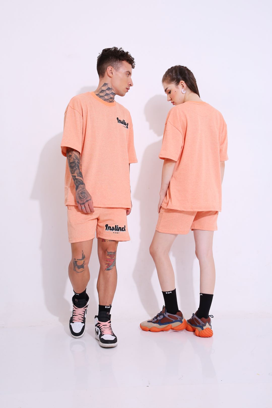 Stylera peach matching set with trendy oversized casual t-shirt on male and female models in streetwear
