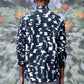 Back view of a man wearing a Stylera trendy printed shirts for men in black and white pattern