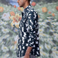 Man wearing trendy printed shirts for men by Stylera with black and white abstract pattern