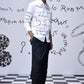 Trendy scribble print shirt by Stylera worn by male model with black pants