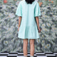 Stylera mint green short dress back view with lace sleeves and sandals trendy sequin dresses for women