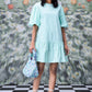 Stylera mint mini dress with puff sleeves and ruffle hem styled with floral bag trendy sequin dresses for women