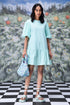 Stylera mint mini dress with puff sleeves and ruffle hem styled with floral bag trendy sequin dresses for women