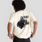 White oversized printed t-shirt by Stylera featuring graphic design on the back worn by male model
