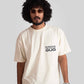 Stylera white oversized printed t-shirt with question the status quo text worn by male model