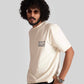Man wearing Stylera white oversized printed t-shirt with black text and black pants