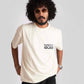 Man wearing a white oversized printed t-shirt with black text on the front by Stylera