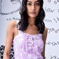 Stylera lilac tie dye lace up women's relaxed fit dungarees with square neckline on model