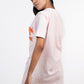 Stylera light pink short sleeve tee seen from back with orange front print women's skinny fit top