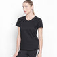 Woman in a Tuna London Sara Basic Sports Tee with net detailing, paired with black pants, standing against a plain white background.