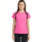 Woman wearing a Tuna London Pink Poly Blend Round Neck Women’s T-Shirt and black shorts stands against a plain white background.