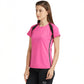 A woman wears a Tuna London Pink Poly Blend Round Neck Women’s T-Shirt with black pants, standing against a white background.