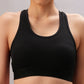 Model wears the Black Sports Bra with adjustable straps, shown from shoulders to waist against a neutral background.