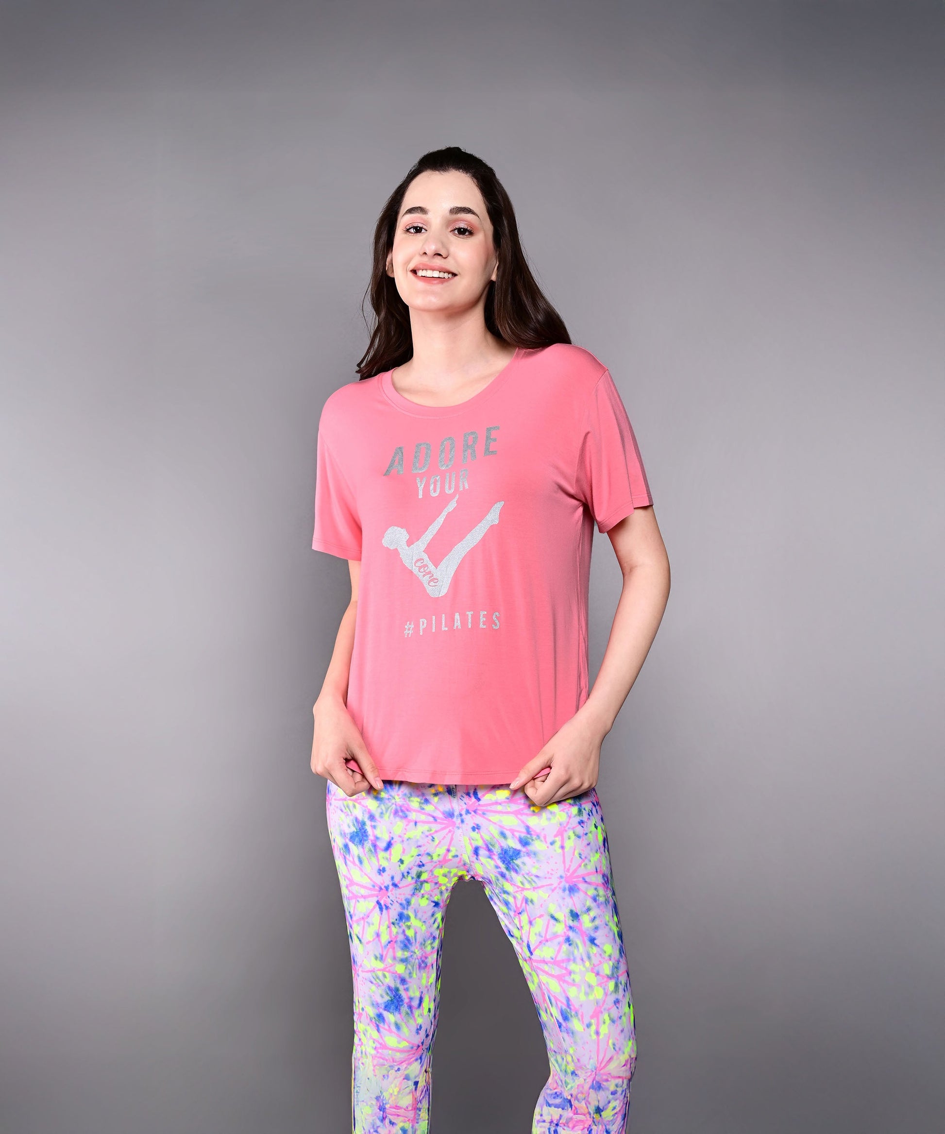 Stylera Adore Your Core printed tee in coral with a relaxed fit for comfort during workouts