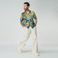 Stylera artisan print short sleeve shirt in vibrant colors, paired with casual trousers for a stylish look