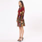 Stylera artistic print mini dress with a tie belt and vibrant colors, perfect for casual outings