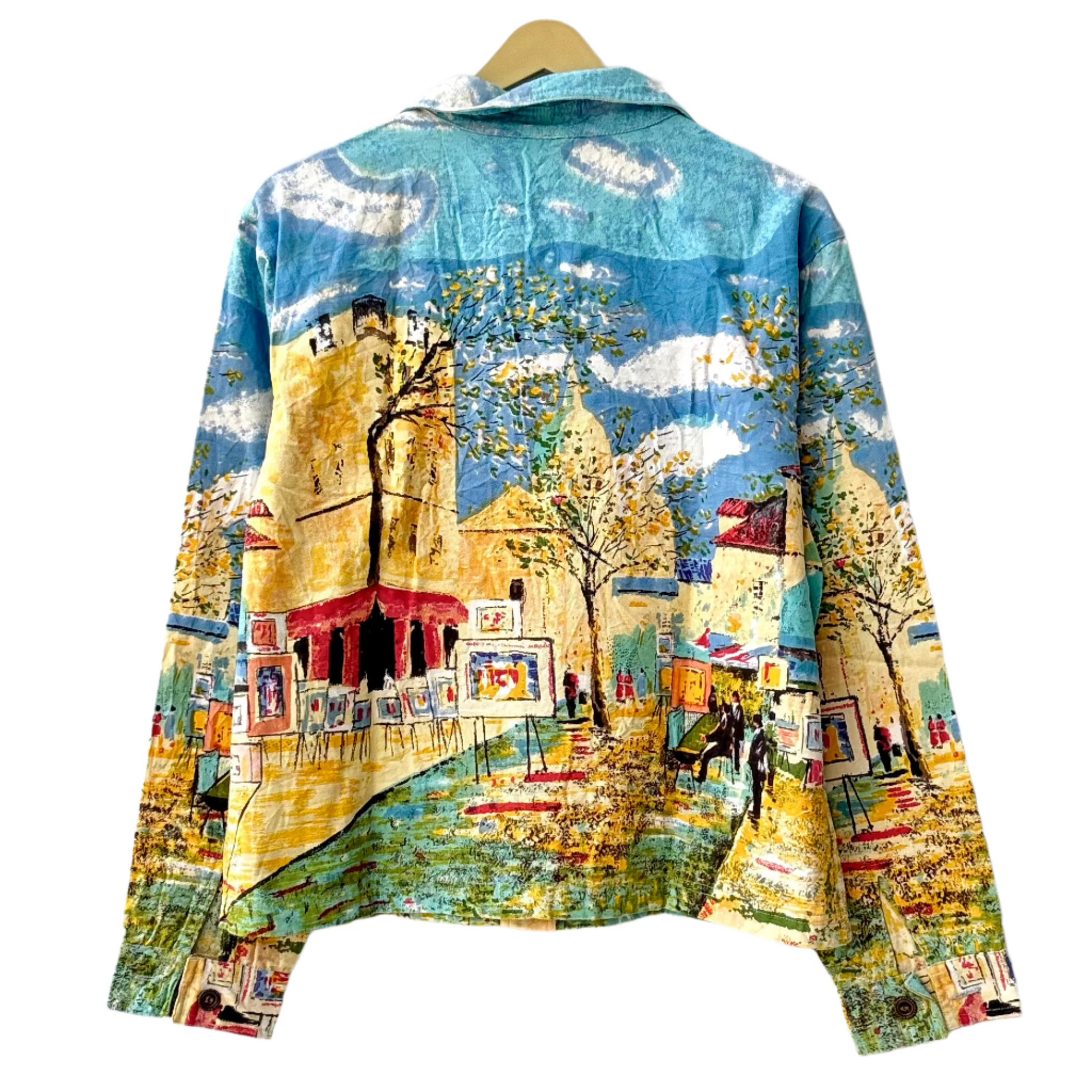 Stylera painted denim jacket outfit featuring colorful hand painted cityscape artwork on back