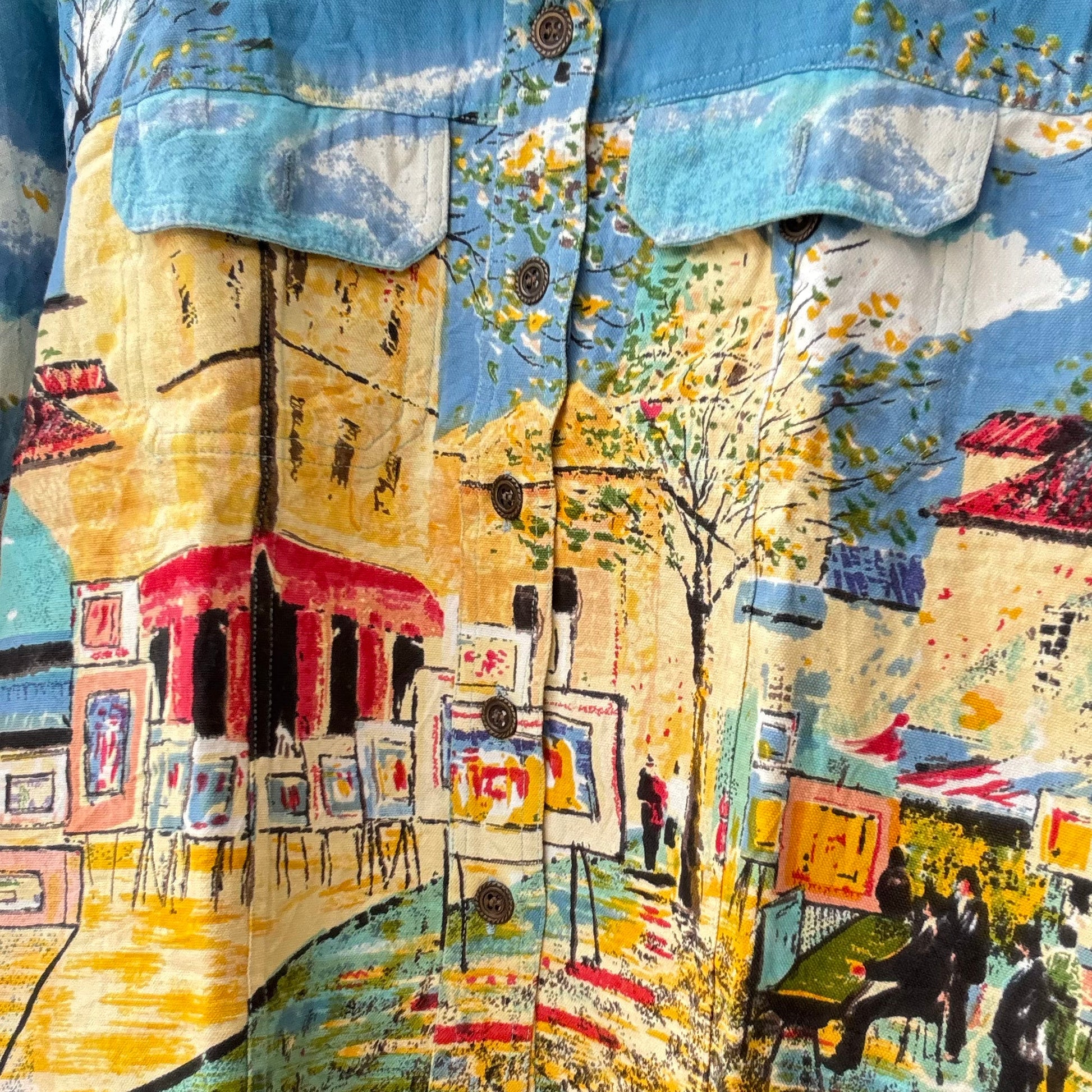 Vintage painted denim jacket outfit with colorful street cafe mural print buttons and flap pockets