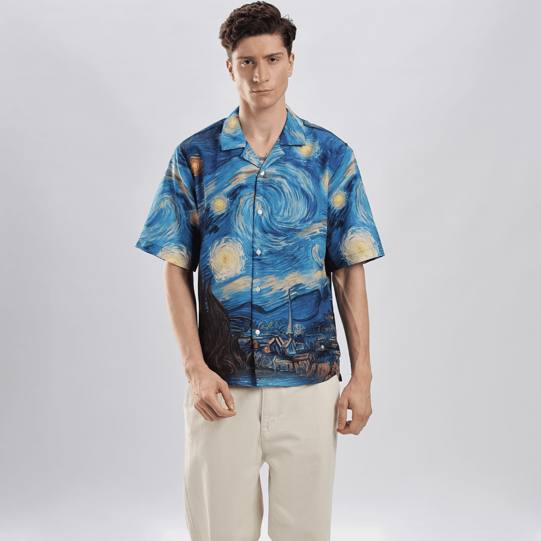 Male model wearing Stylera men's art print casual shirt featuring Van Gogh Starry Night blue swirl print