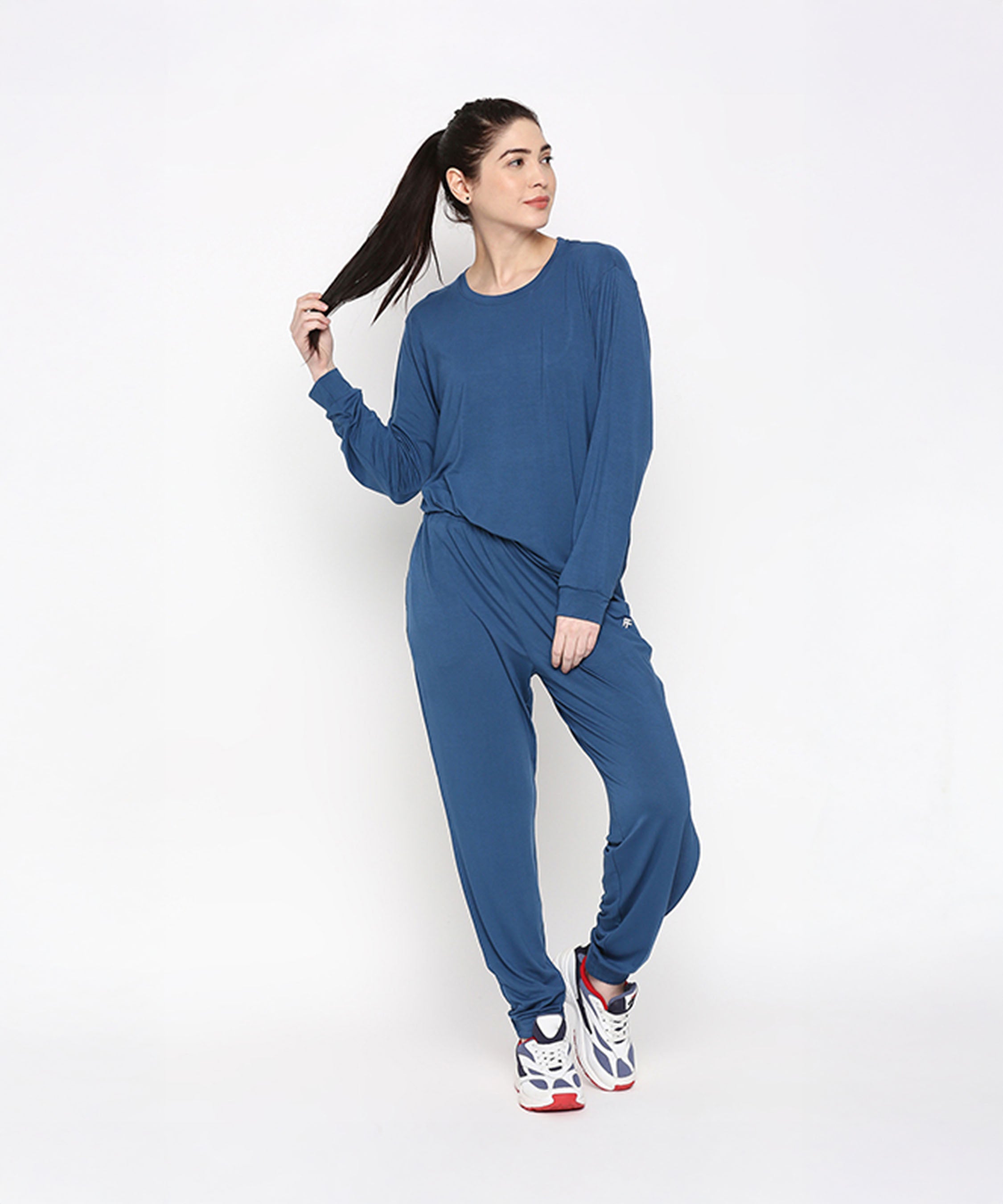 Woman wearing an Atlantic Blue Activewear Set featuring a cozy top and comfortable pants
