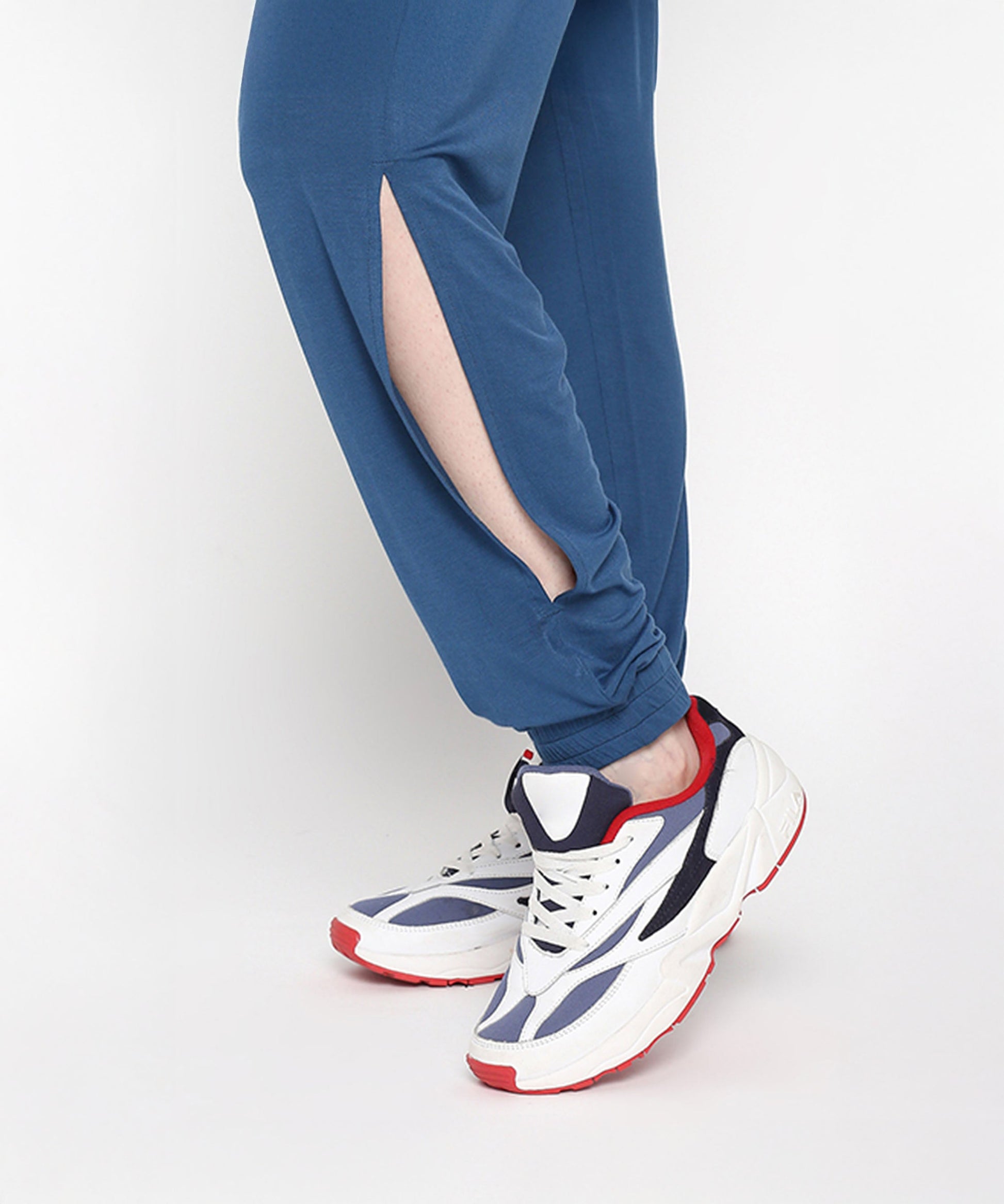 Close-up of the Atlantic blue activewear set featuring stylish tapered joggers with side slits