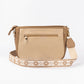 Beige crossbody purse from Stylera with decorative strap and zippered pocket