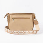 Beige crossbody purse from Stylera with decorative strap and zippered pocket