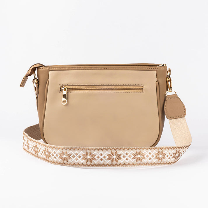 Beige crossbody purse from Stylera with decorative strap and zippered pocket