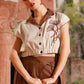 Stylera beige embroidered linen top with dark brown collar and buttons, styled with brown high-waist pants