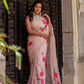 Elegant beige floral chiffon saree with pink flowers, perfect for festive occasions and celebrations