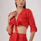 Model wearing Stylera red tie front crop top with matching high waist skirt stylish ombre skirt and top set beach wear