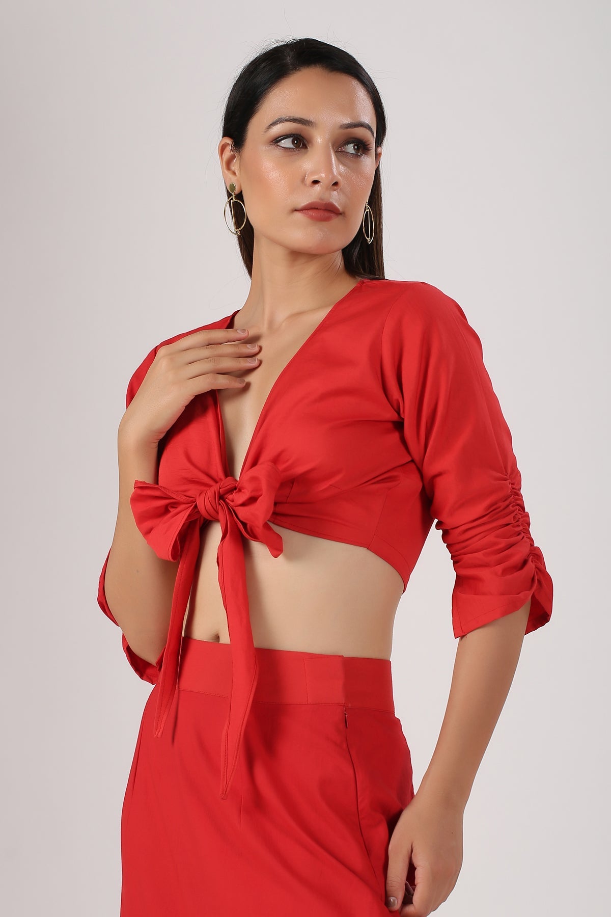 Model wearing Stylera red tie front crop top with matching high waist skirt stylish ombre skirt and top set beach wear