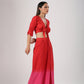 Model wearing Stylera beach wear stylish ombre skirt and top set in red to pink gradient with front slit and tie top