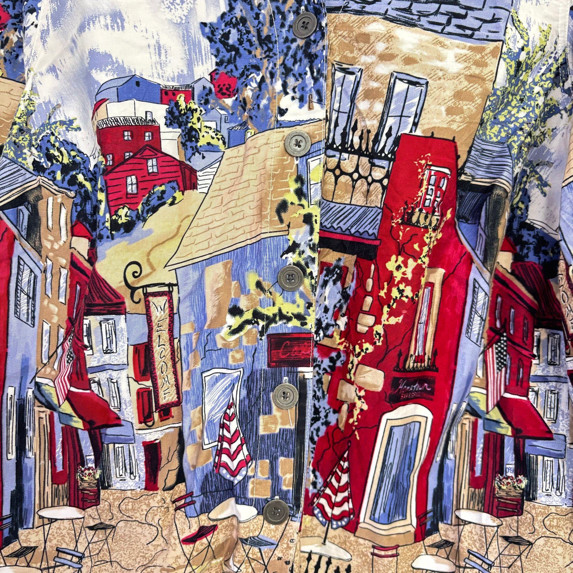 Button front shirt with colorful European cafe print of red buildings and umbrellas unique graphic shirts for women