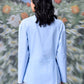 Back view of model wearing unique casual light blue shirt for women by Stylera long sleeves