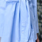 Stylera unique casual light blue shirt for women with waist tie and button cuffs close up