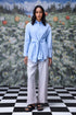 Stylera model wearing unique casual light blue shirt for women tie front long sleeves with wide leg pants