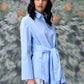 Stylera model wearing unique casual light blue shirt for women collared button down with waist tie