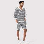 Stylish black and white patterned shorts men paired with a matching top for casual wear