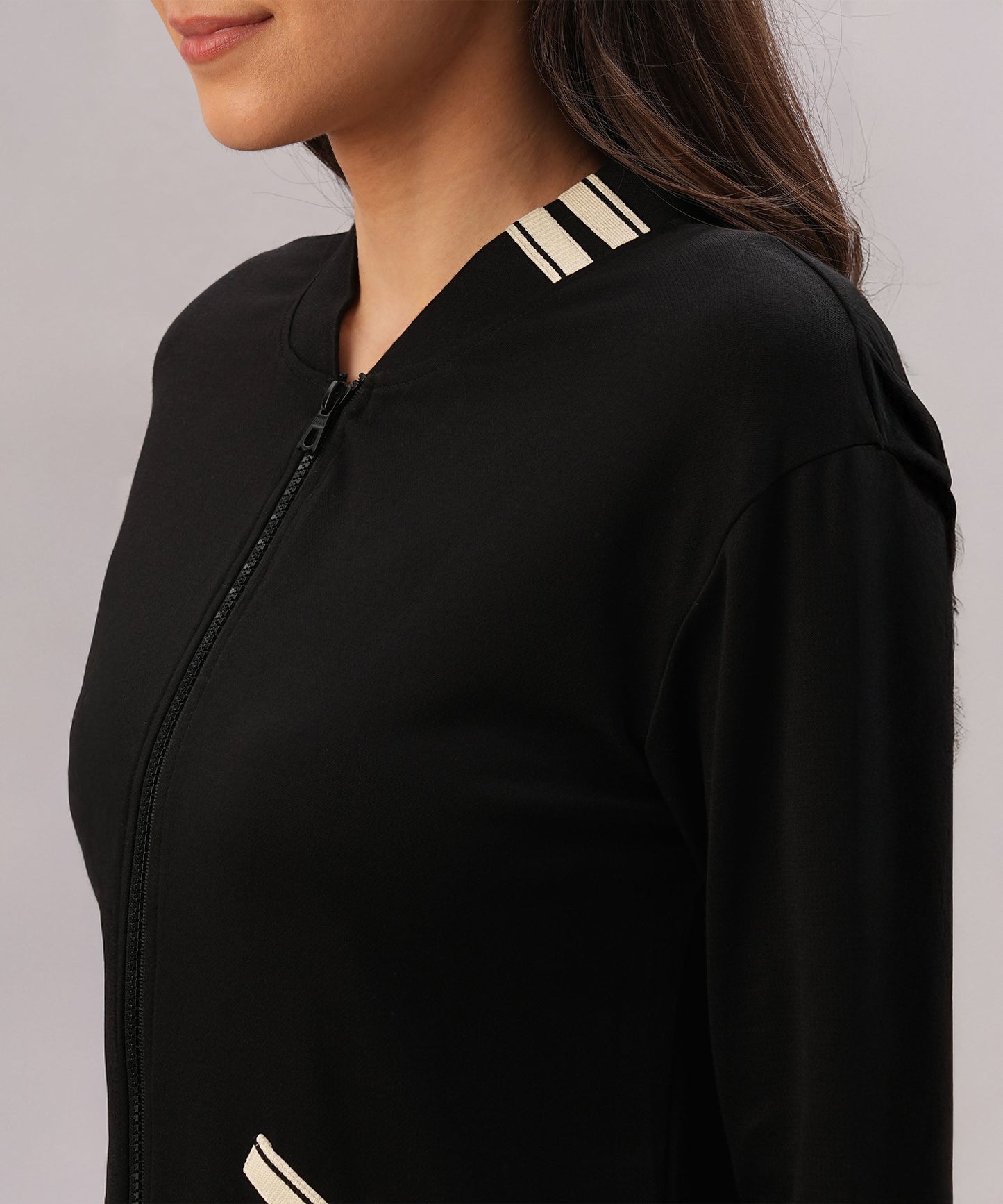 Stylish black co-ord set for women featuring a zip-up top with striped detailing