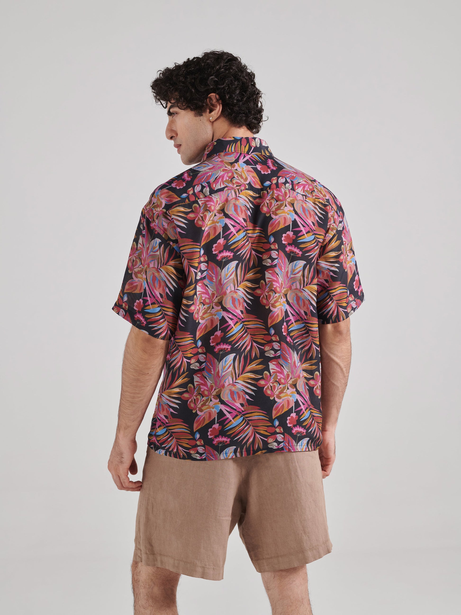 Elegant black floral drop shoulder shirt from Stylera with vibrant tropical prints