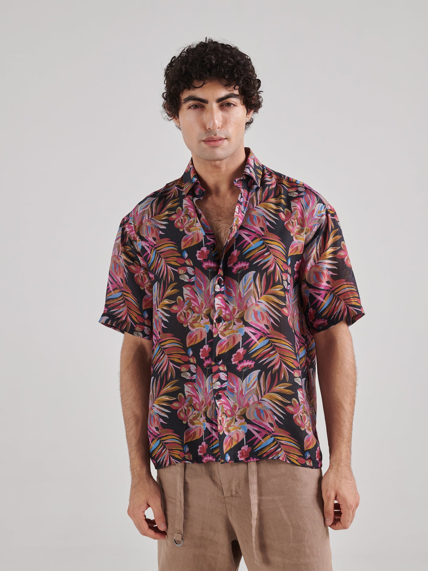 Men's black floral drop shoulder shirt with vibrant tropical print and relaxed fit