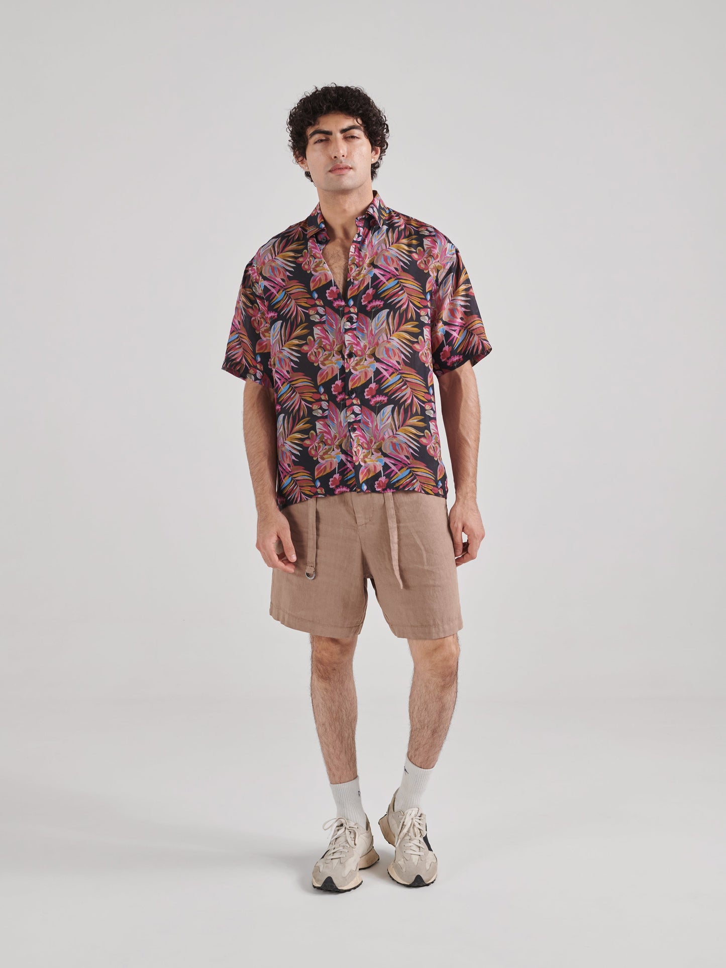 Men's black floral drop shoulder shirt by Stylera featuring vibrant tropical prints for a stylish look.