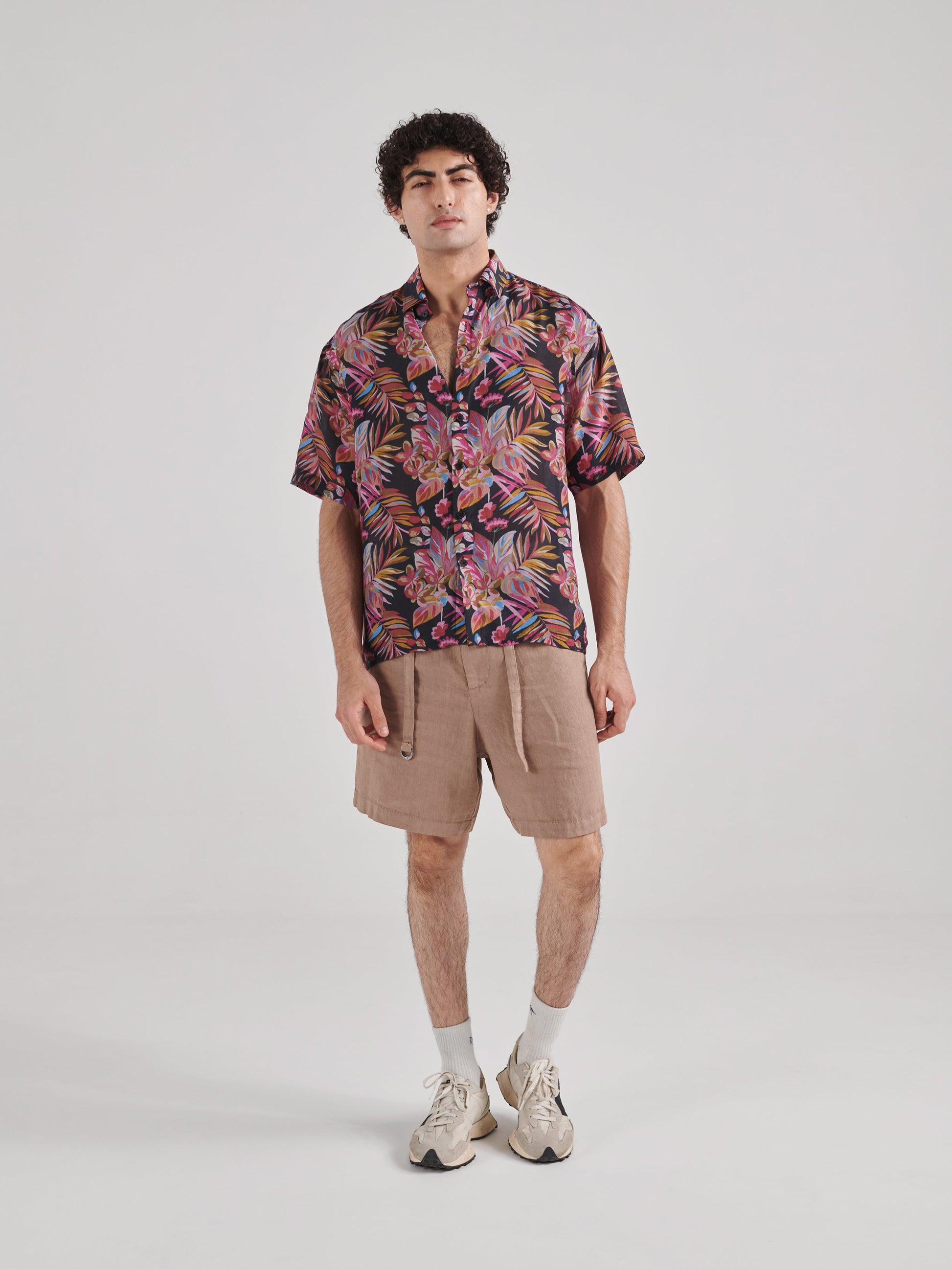 Men's black floral drop shoulder shirt by Stylera featuring vibrant tropical prints for a stylish look.