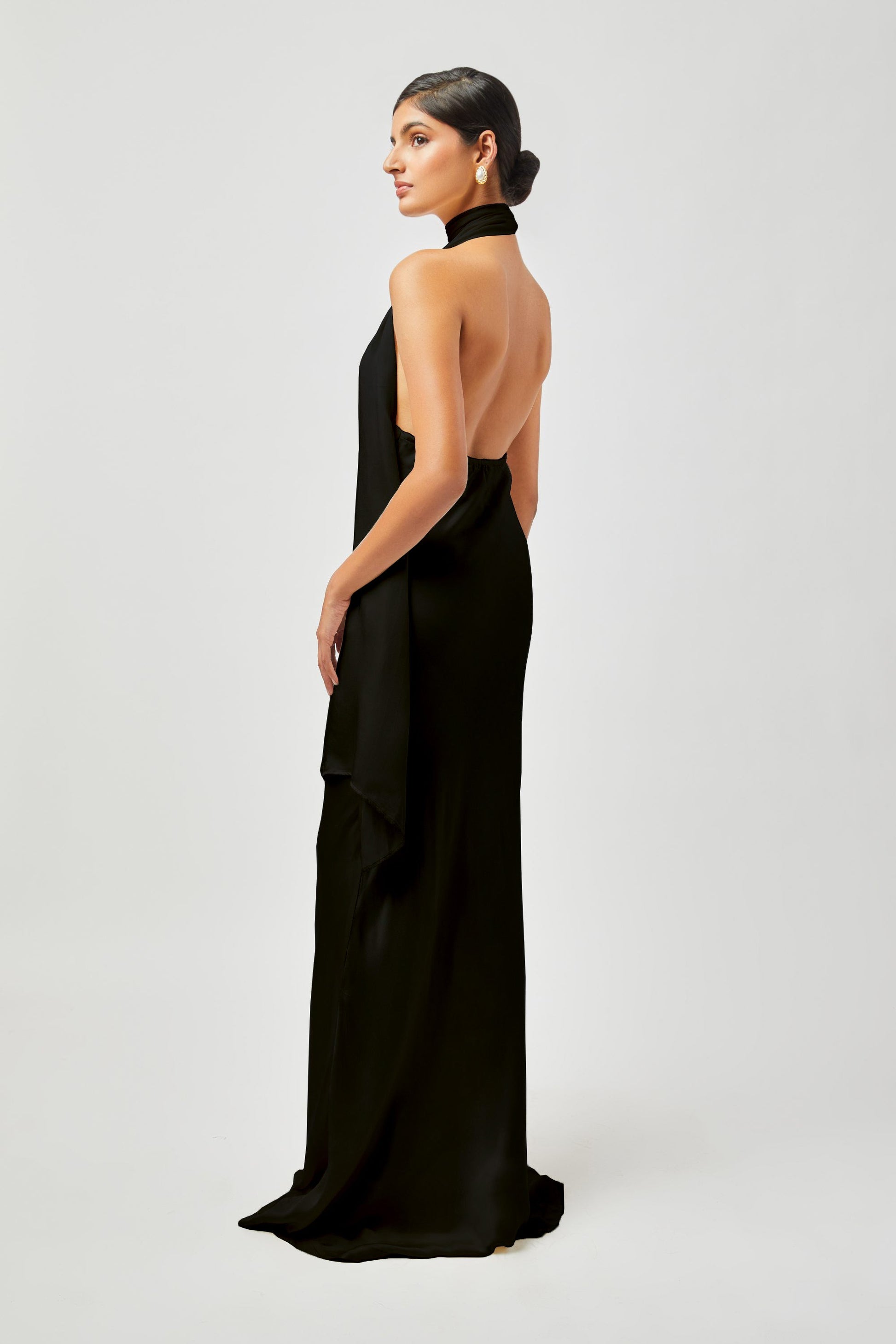 Stylera black formal gown for women with halter neck and open back design